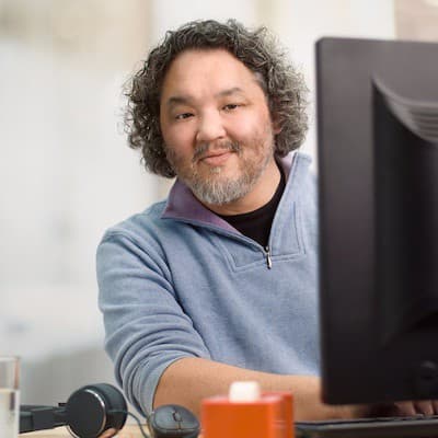 Kenji Kato at his desk.